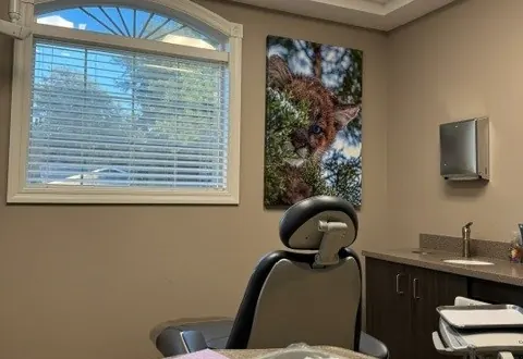 A care room at Times Square Dental with the chair ready for a patient.