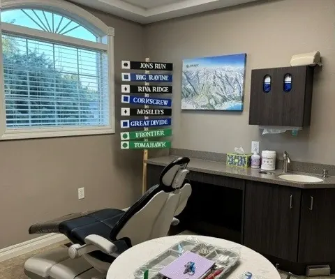 A Times Square Dental care room with the chair, instrument table and cabinetry.